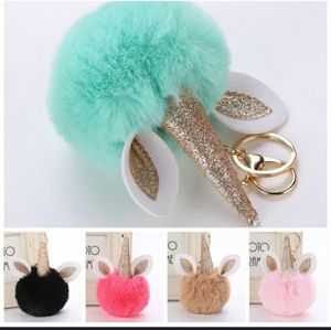 Unicorn keychain puff ball purple gold purse chain